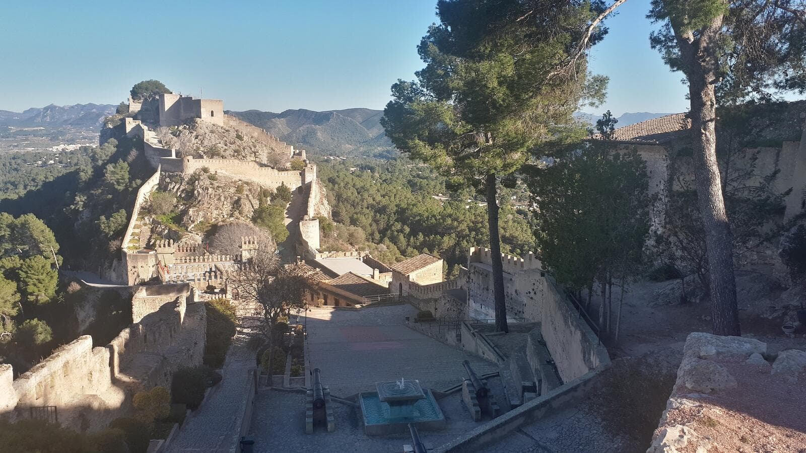 The castle of Xàtiva running along its ridge, seen from the terrace below the walls.