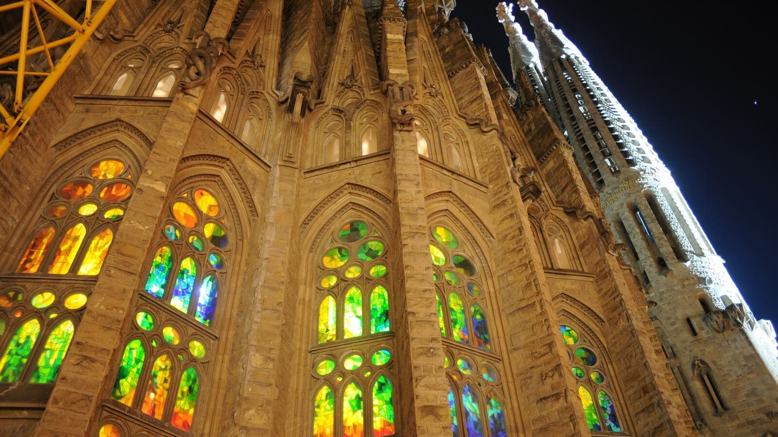 Stained-glass windows and stone columns inside the Sagrada Família in Barcelona.